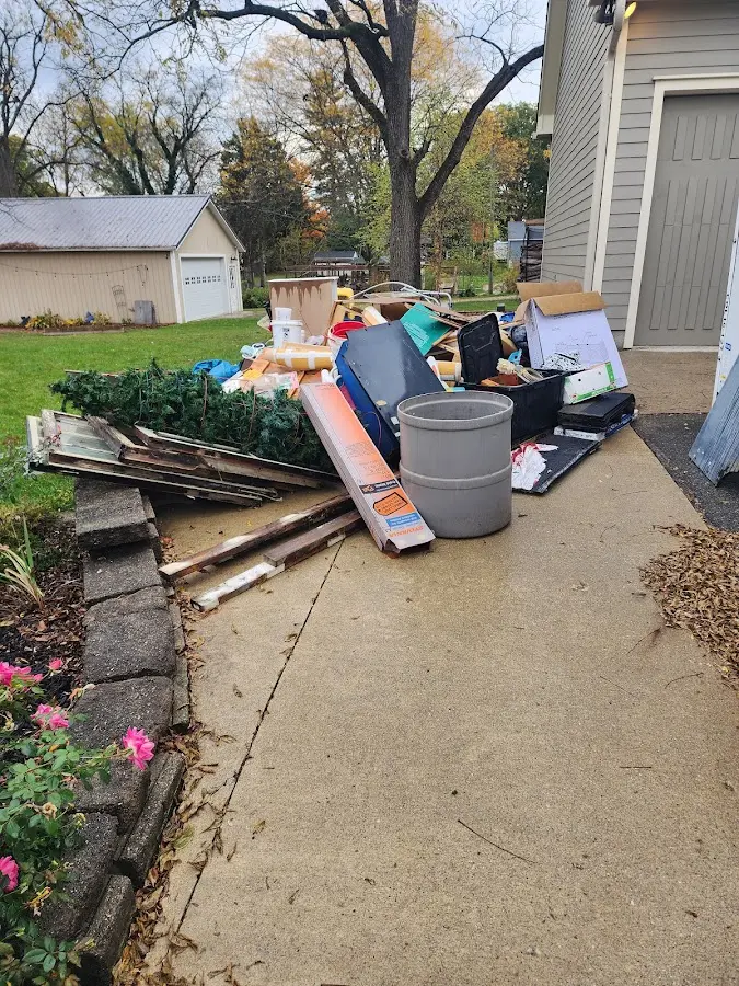 Dumpster being loaded with debris for 30 Yard Dumpster Rental in Tucson
